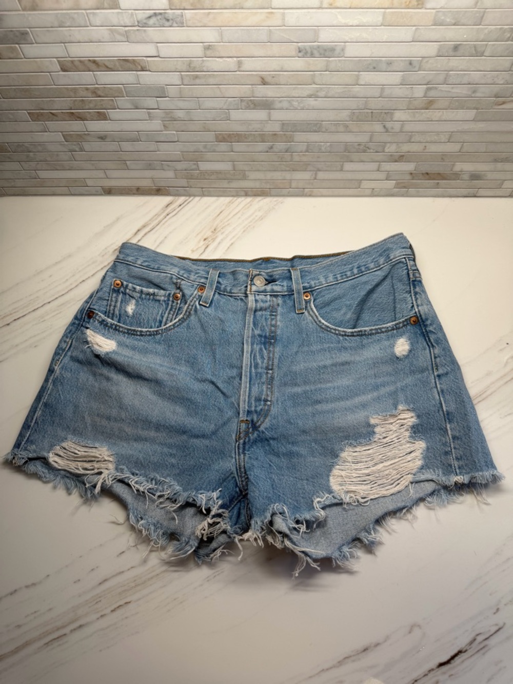 Levi’s 501: Distressed Light Blue Denim Women's Shorts (Size 29)